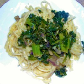 Sauteed kale, spinach and mushrooms over butter garlic linguine